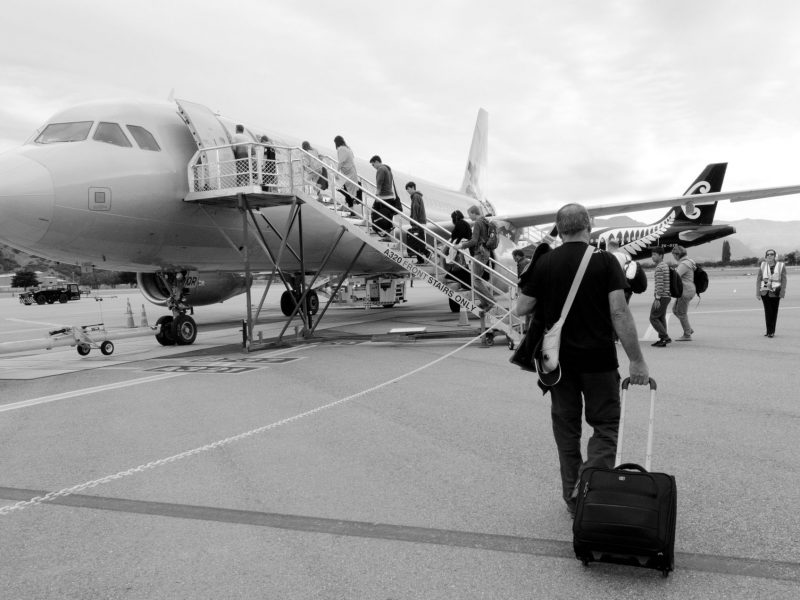 Passengers boarding Air NZ plane on the runway